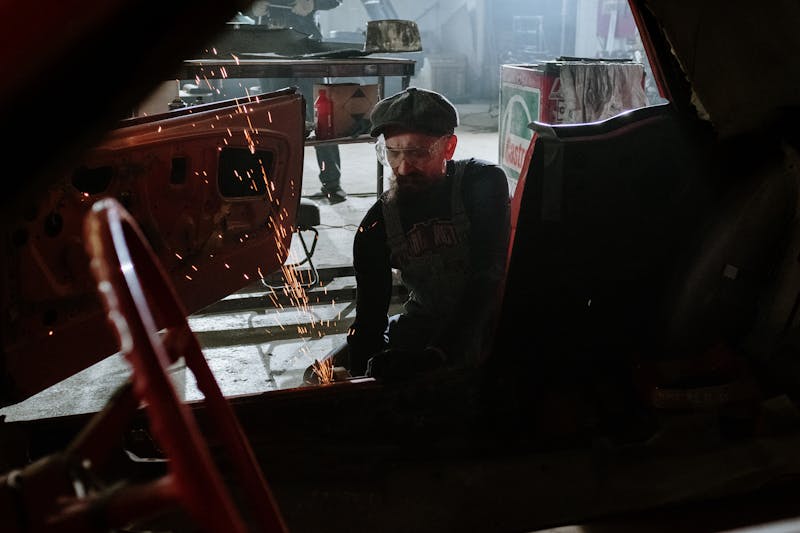 Mechanic inspecting an engine bay