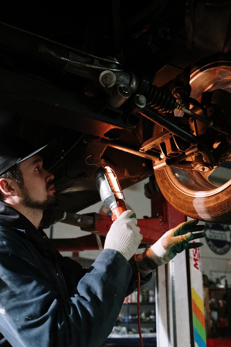 Auto technician using diagnostic tool