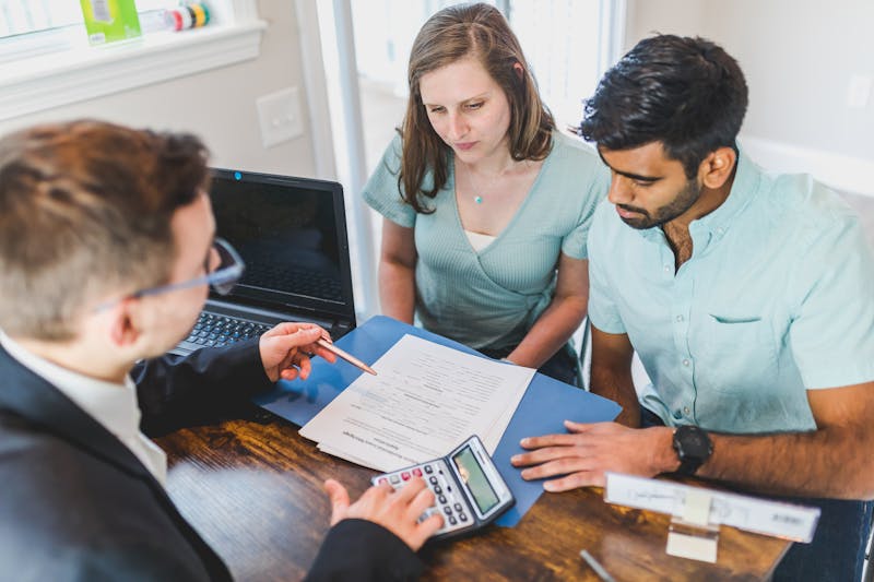 Real estate agent showing property to clients